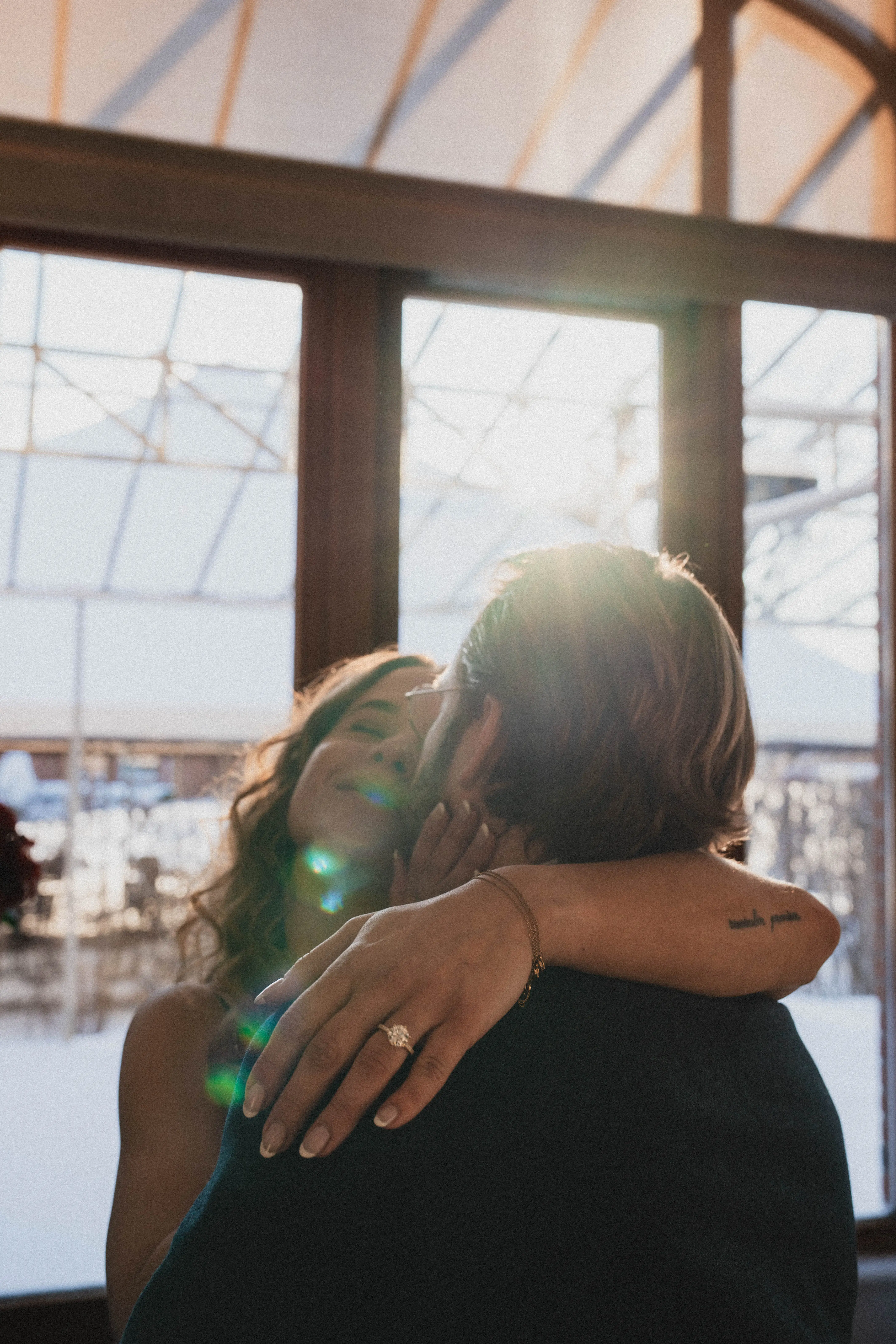 Louis and Camille embracing